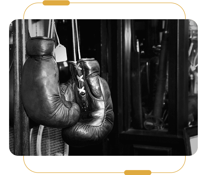 A pair of boxing gloves hanging from the wall.